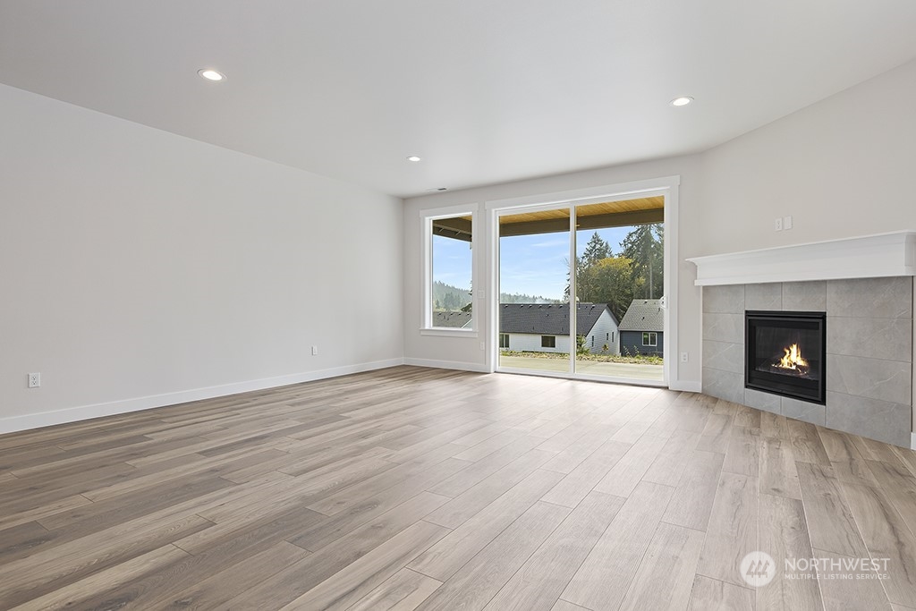 1036 Okerlund Drive Enumclaw, WA 98022 - Photo 15 of 23 wooden floor in an empty room with a window