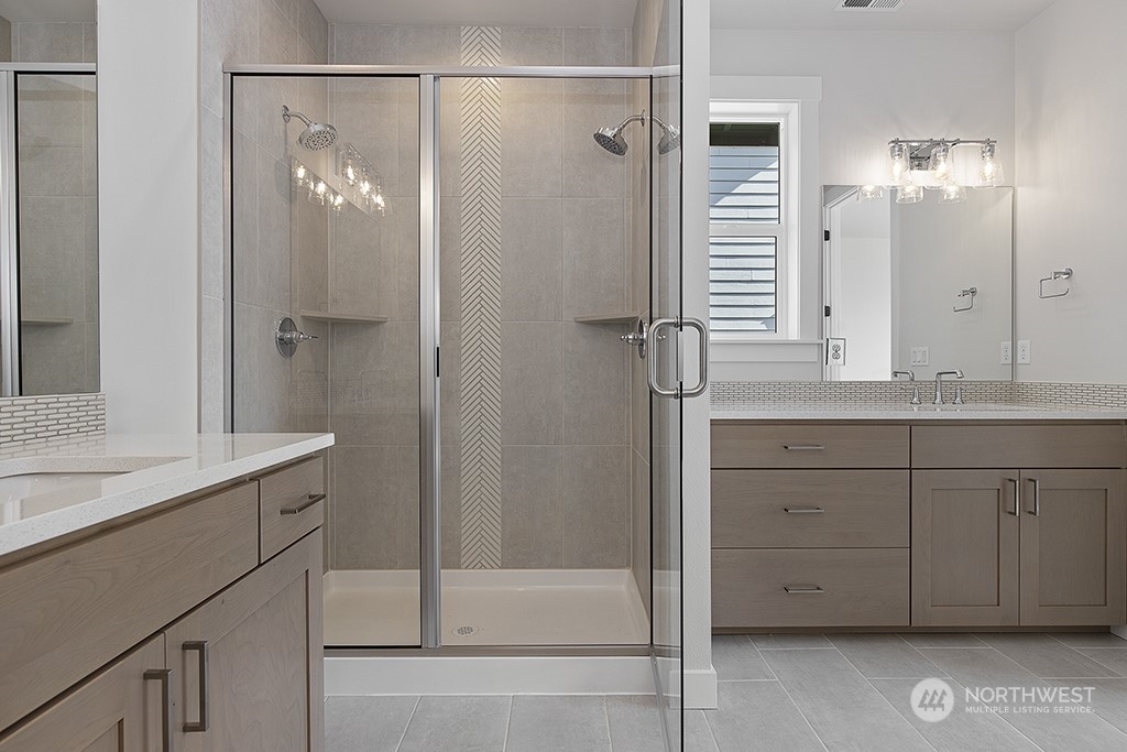 1036 Okerlund Drive Enumclaw, WA 98022 - Photo 20 of 23 a bathroom with a shower sink and mirror