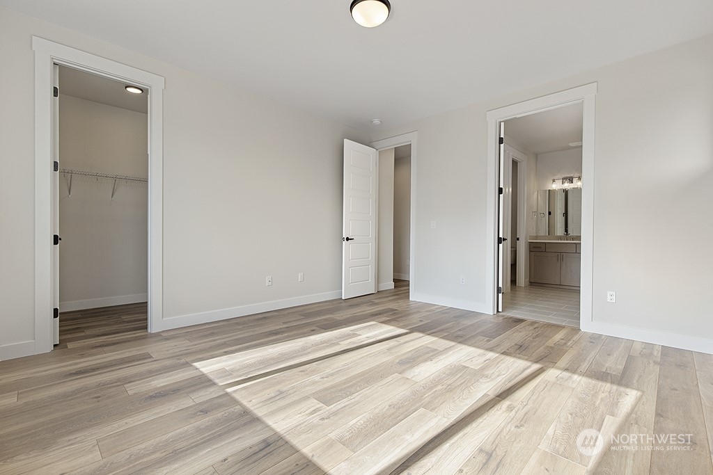 1036 Okerlund Drive Enumclaw, WA 98022 - Photo 22 of 23 an empty room with wooden floor and windows