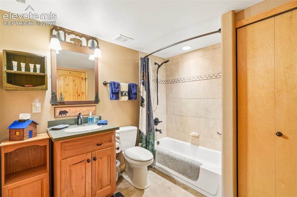858 Oak Ridge Road Manitou Springs, CO 80829 - Photo 41 of 50 Full bathroom with laundry near bedroom 3 on lower level