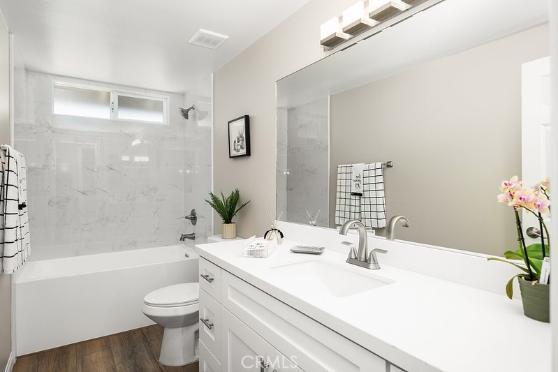 14331 Fernbrook Drive Tustin, CA 92780 - Photo 20 of 35 a bathroom with a sink a toilet and shower