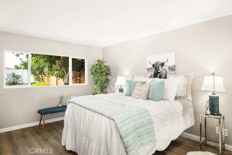 14331 Fernbrook Drive Tustin, CA 92780 - Photo 22 of 35 a bedroom with a bed and a large window