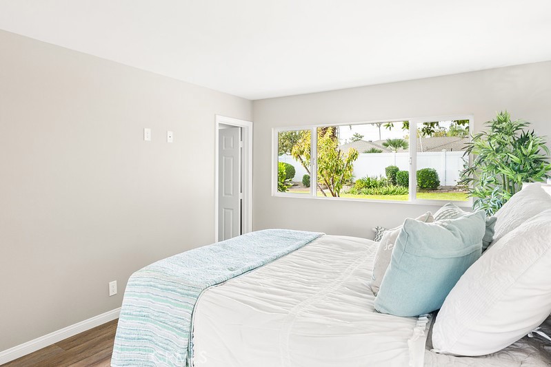 14331 Fernbrook Drive Tustin, CA 92780 - Photo 23 of 35 a bedroom with a bed and a large window