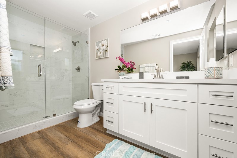 14331 Fernbrook Drive Tustin, CA 92780 - Photo 26 of 35 a bathroom with a sink vanity mirror and toilet