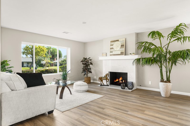14331 Fernbrook Drive Tustin, CA 92780 - Photo 6 of 35 a living room with furniture and a fireplace