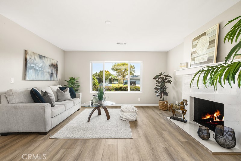 14331 Fernbrook Drive Tustin, CA 92780 - Photo 7 of 35 a living room with furniture and a fireplace