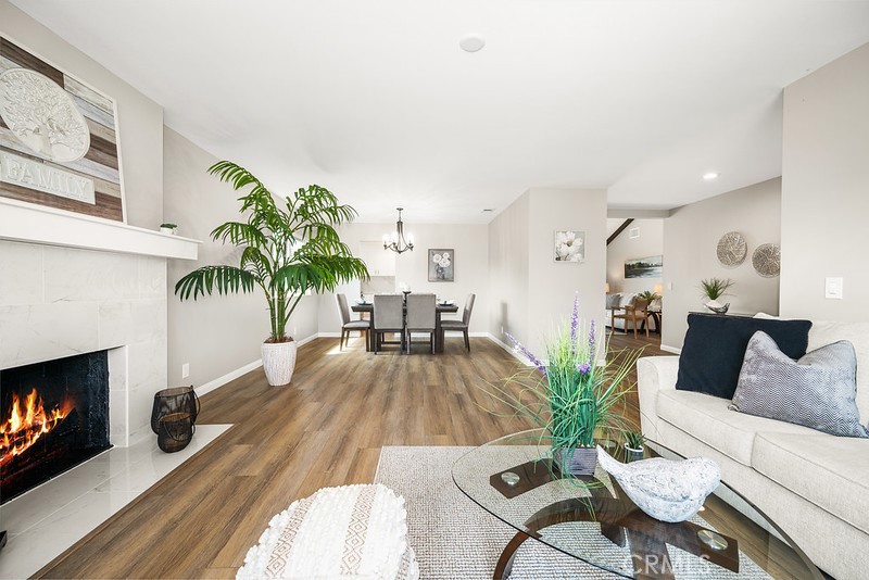 14331 Fernbrook Drive Tustin, CA 92780 - Photo 8 of 35 a living room with furniture and a fireplace