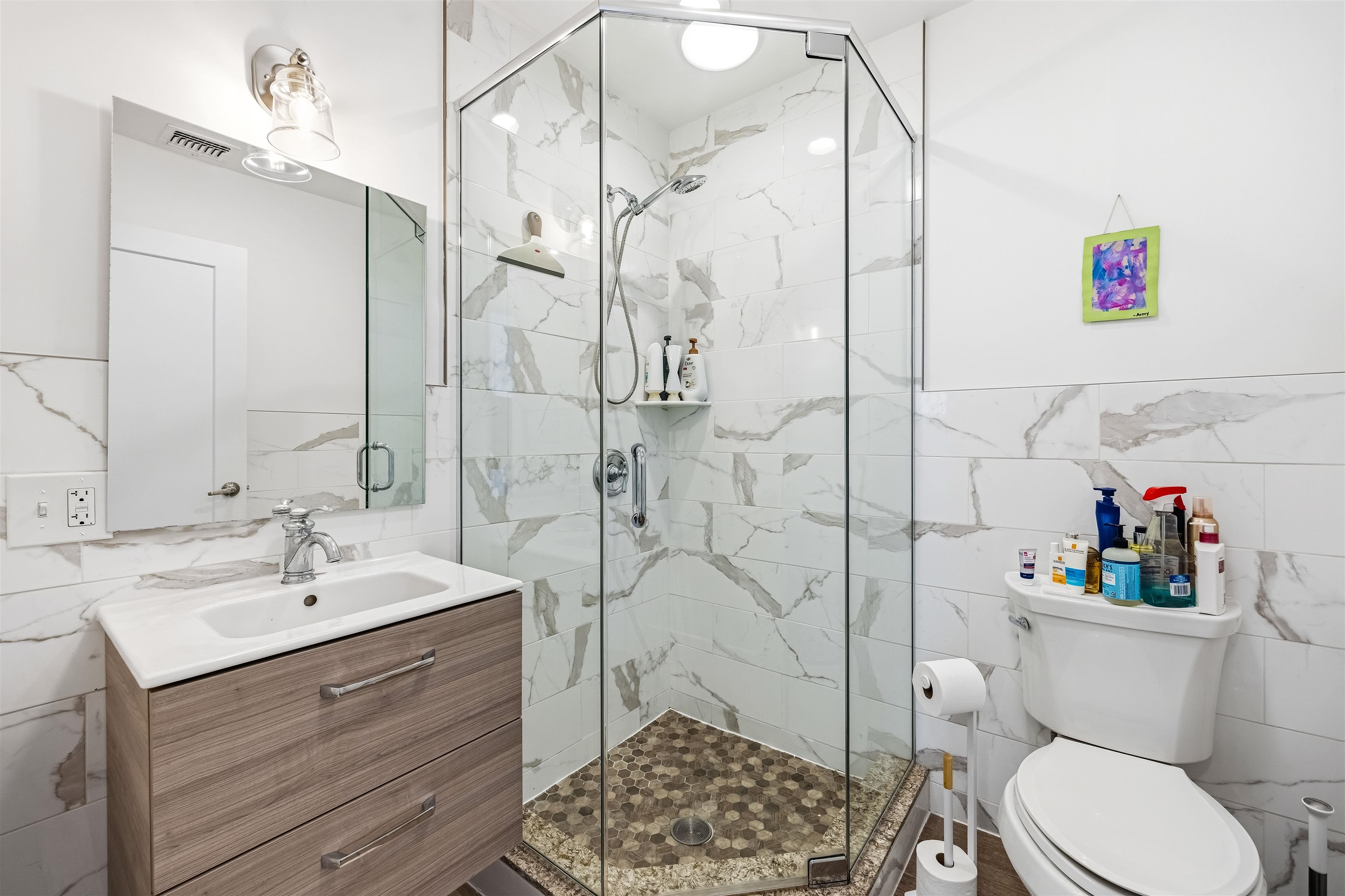 107 Mountain Road Jersey City, NJ 07307 - Photo 23 of 41 a bathroom with a sink a toilet and shower