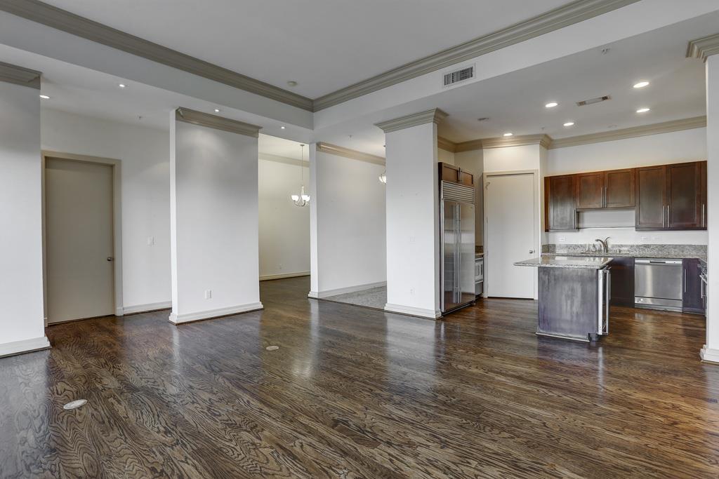 a view of kitchen with cabinets and wooden floor