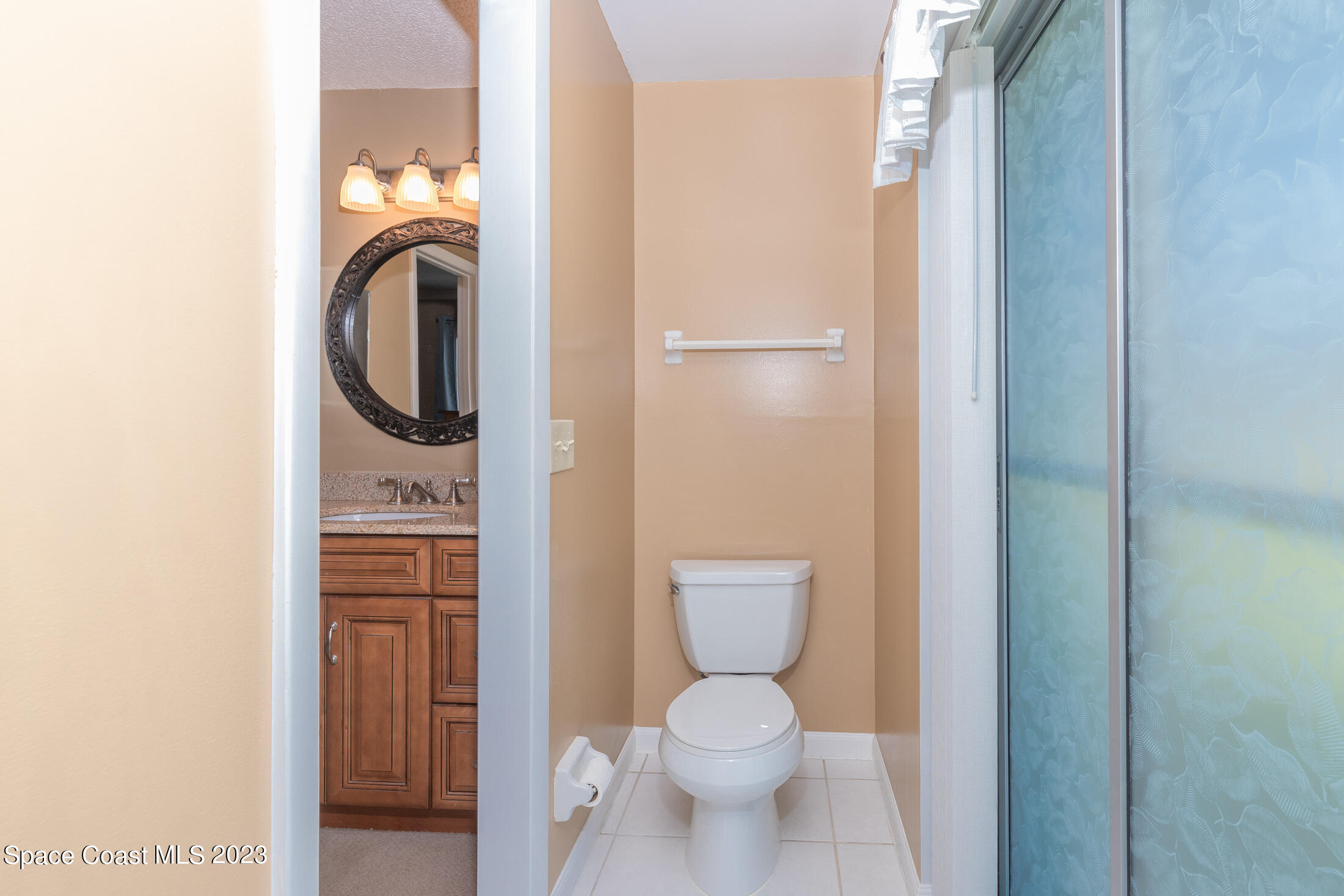 978 Locust Avenue Palm Bay, FL 32907 - Photo 18 of 41 a bathroom with a toilet and a sink