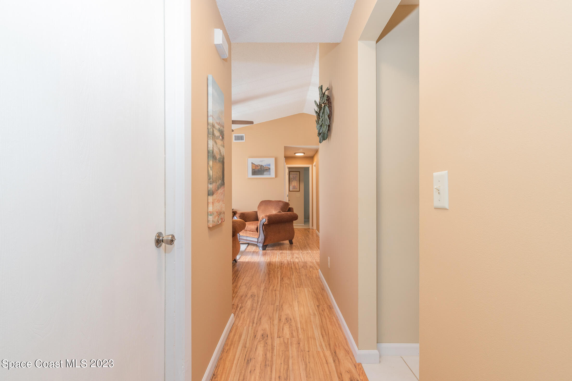 978 Locust Avenue Palm Bay, FL 32907 - Photo 19 of 41 a view of a bedroom from a hallway