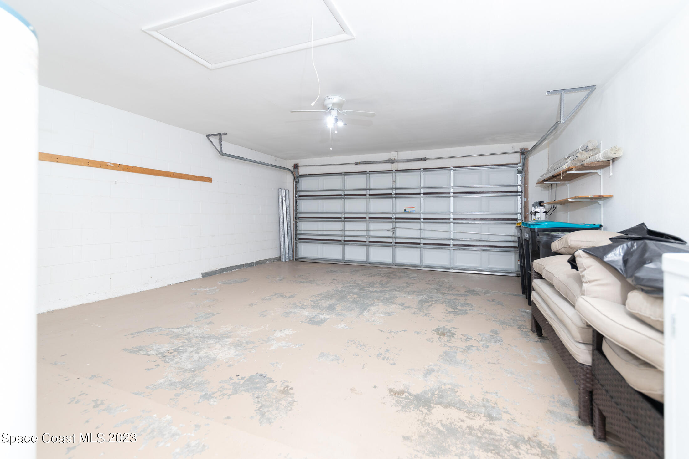 978 Locust Avenue Palm Bay, FL 32907 - Photo 24 of 41 a view of walk in closet with empty racks