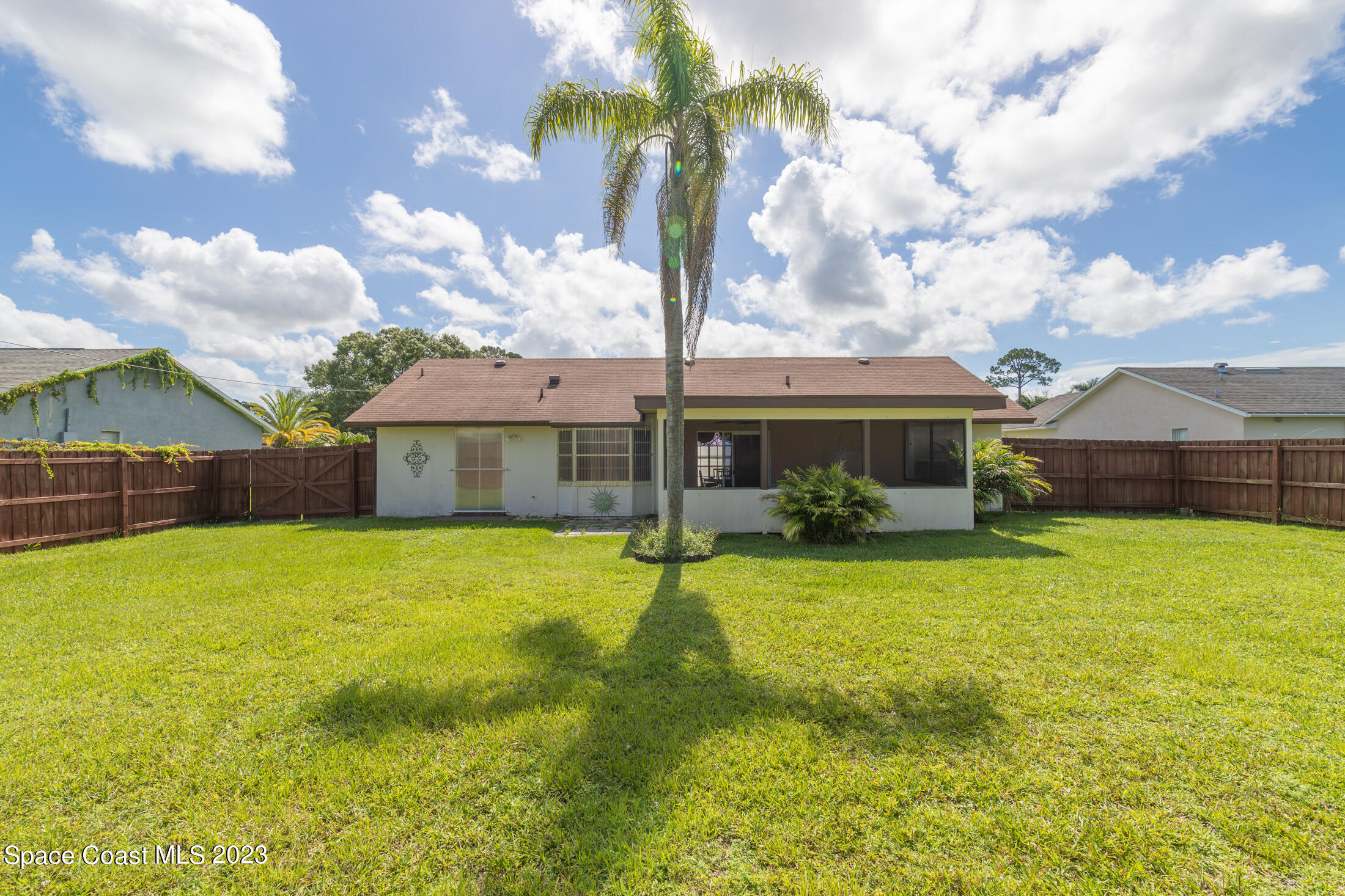 978 Locust Avenue Palm Bay, FL 32907 - Photo 29 of 41 a front view of house with yard and porch