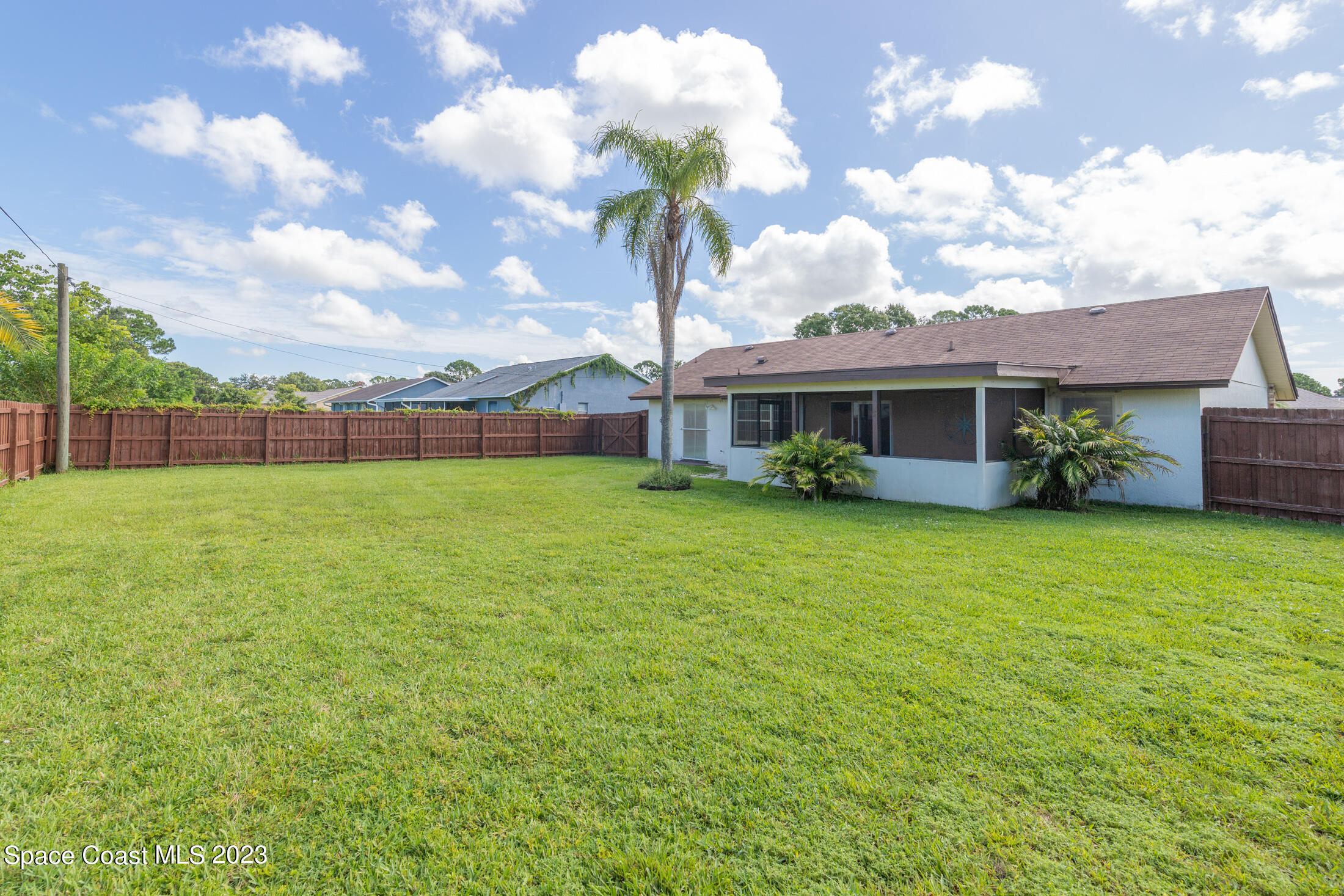 978 Locust Avenue Palm Bay, FL 32907 - Photo 30 of 41 a front view of a house with garden
