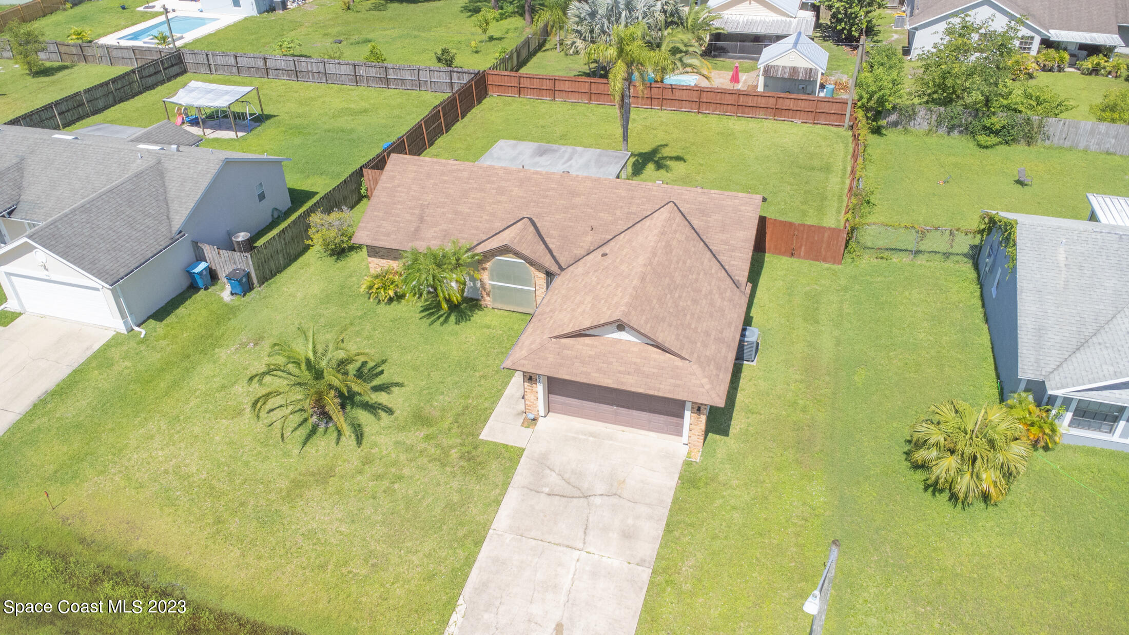 978 Locust Avenue Palm Bay, FL 32907 - Photo 33 of 41 a view of yard with swimming pool