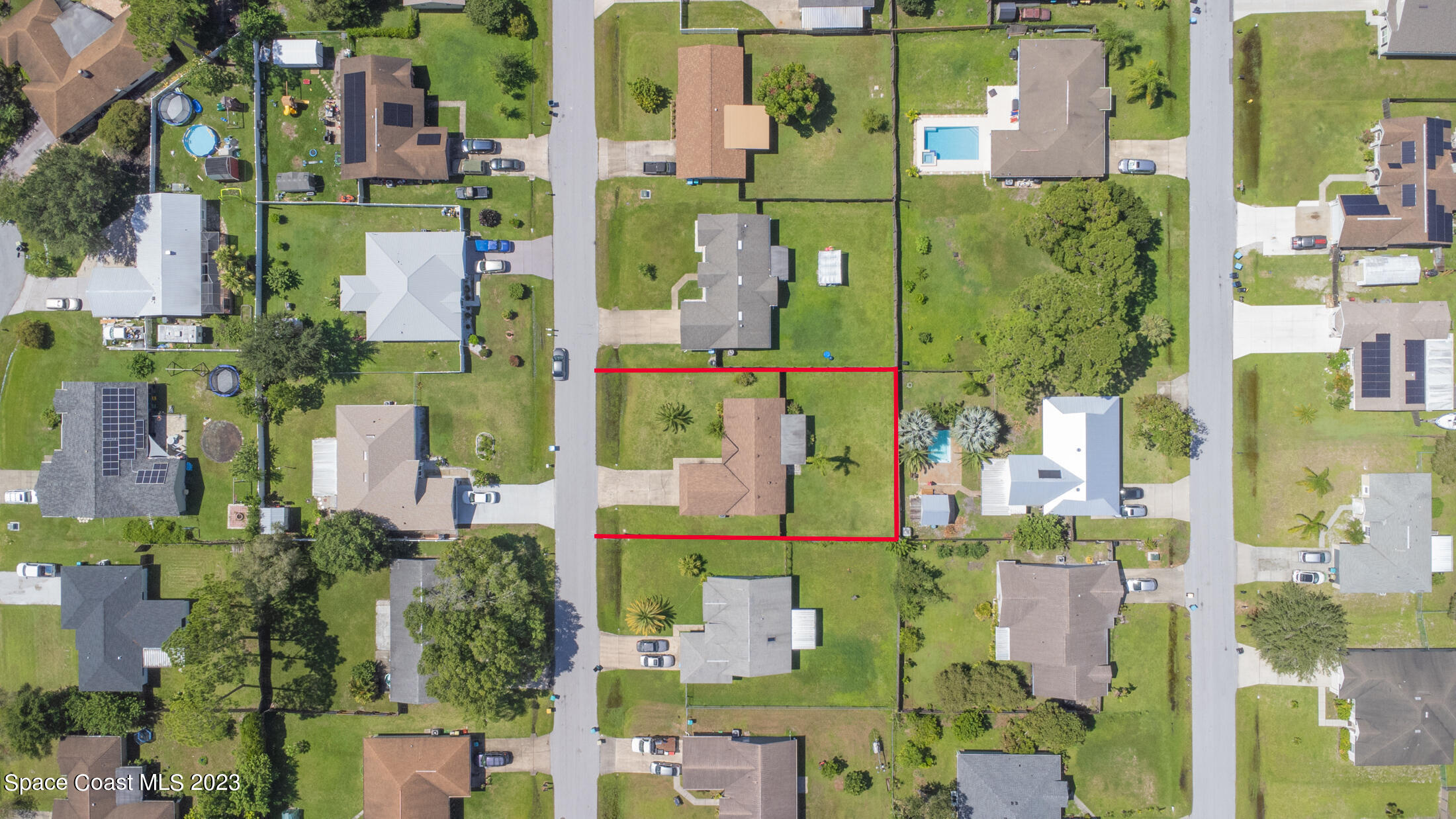 978 Locust Avenue Palm Bay, FL 32907 - Photo 34 of 41 aerial view of multiple houses with yard