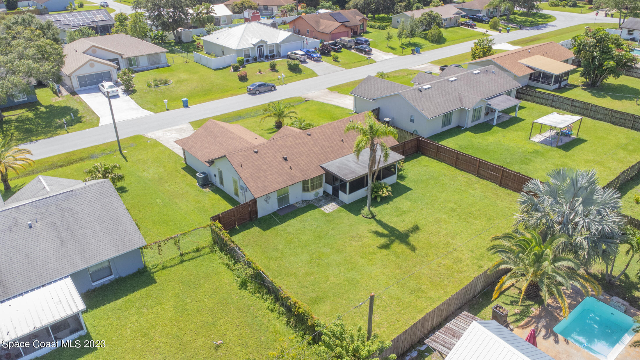 978 Locust Avenue Palm Bay, FL 32907 - Photo 39 of 41 an aerial view of residential house with outdoor space and swimming pool