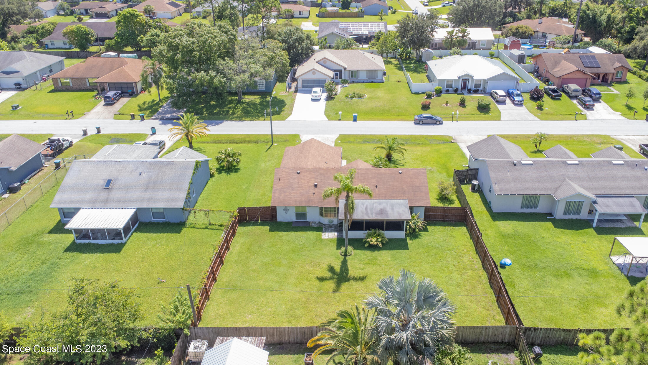 978 Locust Avenue Palm Bay, FL 32907 - Photo 40 of 41 an aerial view of a house with swimming pool and outdoor seating