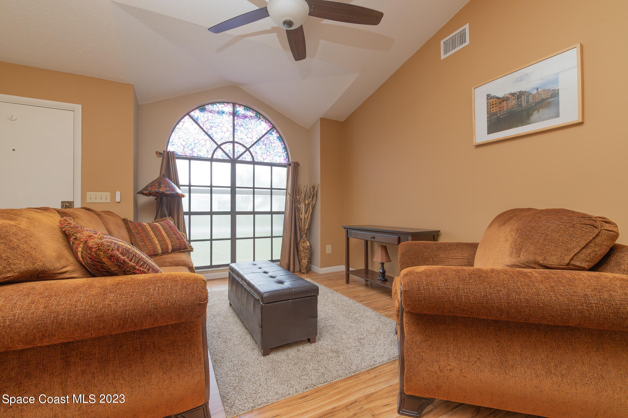 978 Locust Avenue Palm Bay, FL 32907 - Photo 6 of 41 a living room with furniture and a window