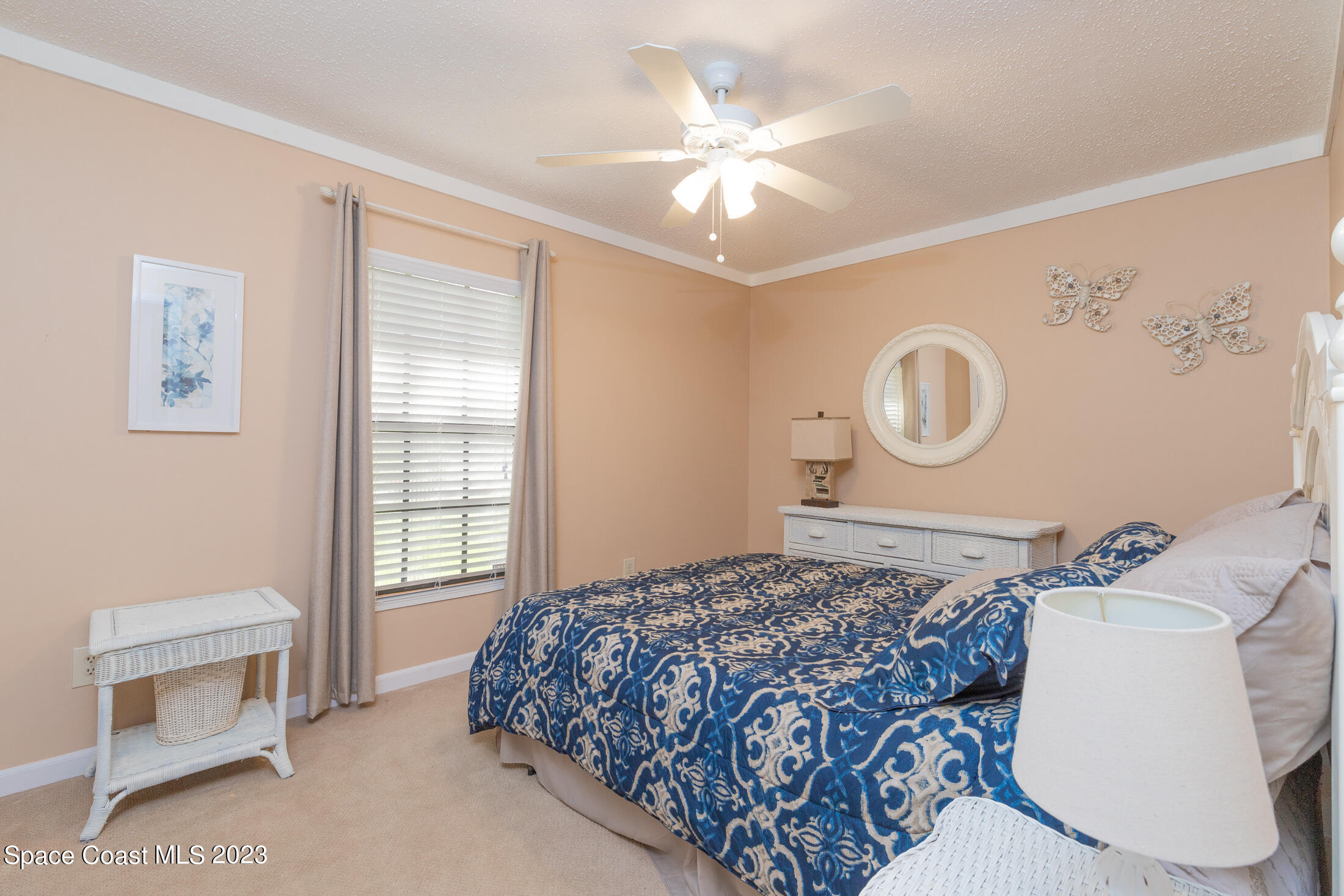 978 Locust Avenue Palm Bay, FL 32907 - Photo 10 of 41 a bedroom with a bed and a window