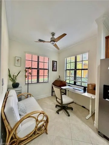 a work room with furniture and a window