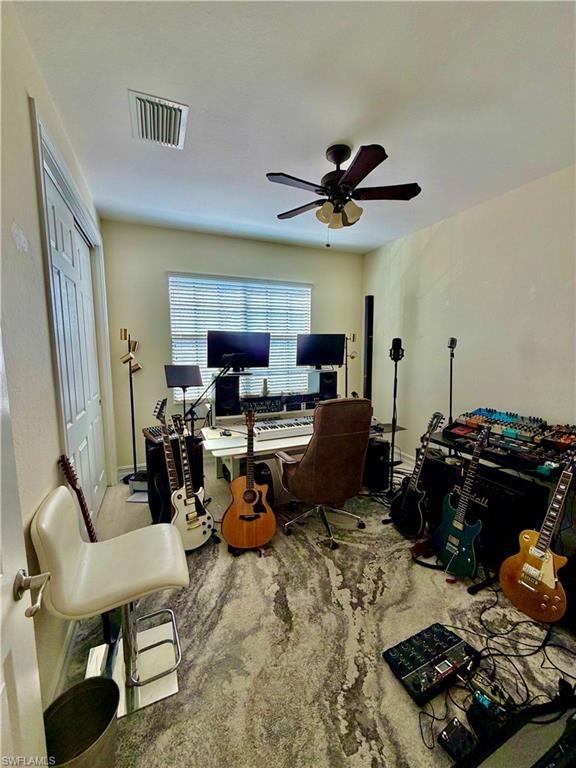 9109 Yuba Lane, Unit 80 Naples, FL 34113 - Photo 7 of 15 a living room with furniture and a flat screen tv