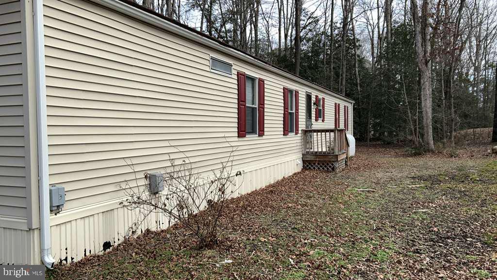 8 Merganser Road Georgetown, DE 19947 - Photo 1 of 13 a side view of a house with a yard