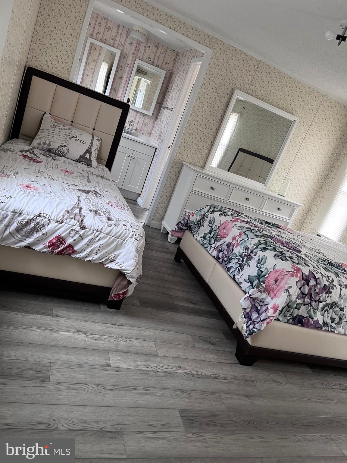 8 Merganser Road Georgetown, DE 19947 - Photo 11 of 13 a bed sitting in a bedroom next to a lamp