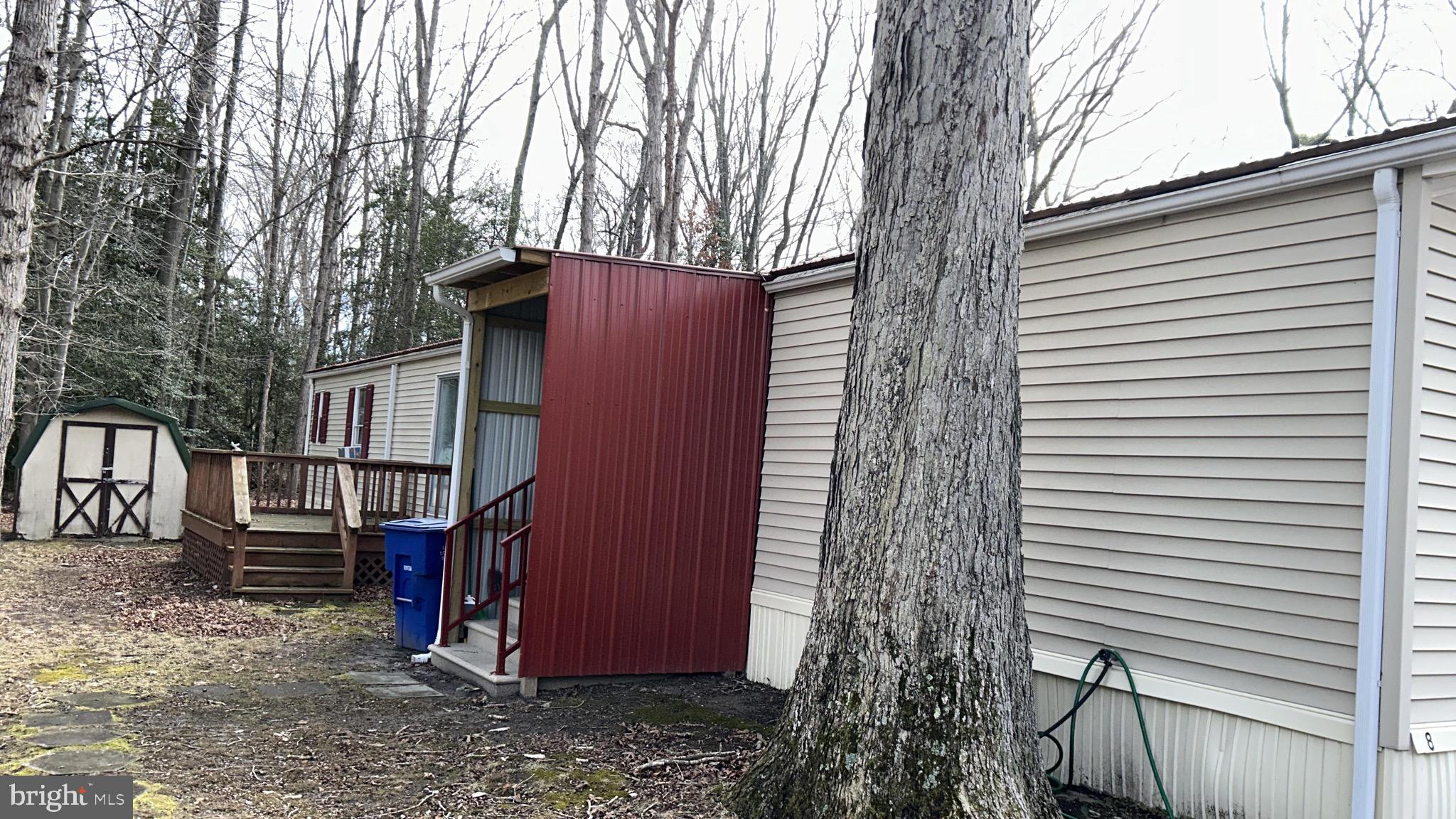 8 Merganser Road Georgetown, DE 19947 - Photo 12 of 13 a couple of potted plants in front of a house