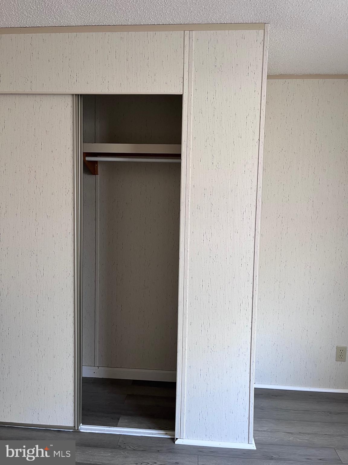 8 Merganser Road Georgetown, DE 19947 - Photo 10 of 13 a view of walk in closet with wooden floor
