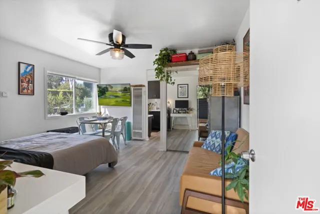 a bedroom with furniture and a window