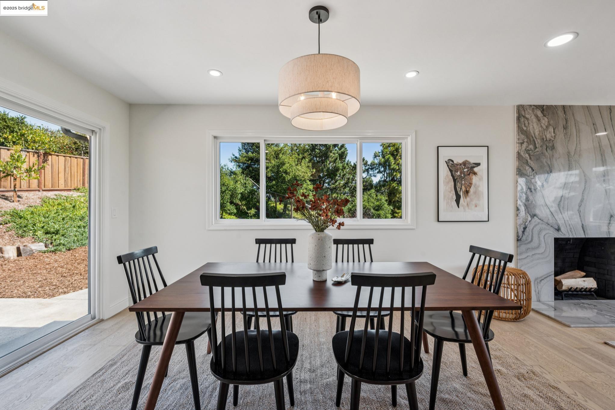 9 Yarmouth Court Oakland, CA 94619 - Photo 10 of 54 Dining room with light wood finished floors, recessed lighting, and a fireplace