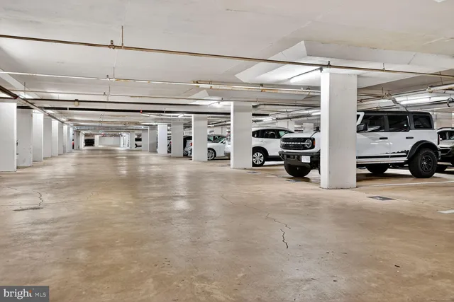 a front view of a building with parking