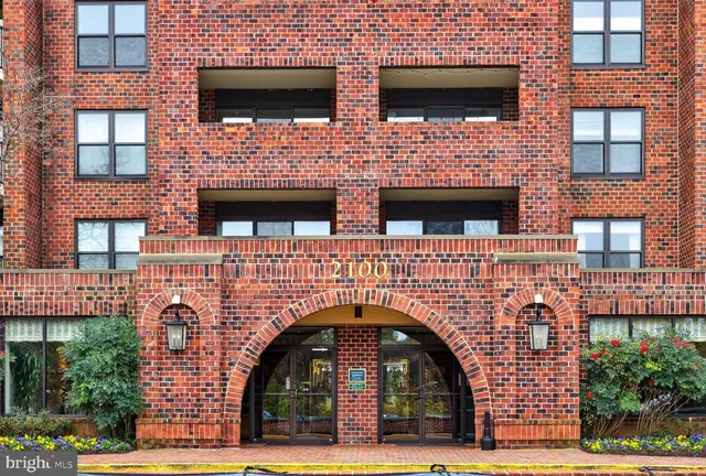 a lobby with furniture and a potted plant