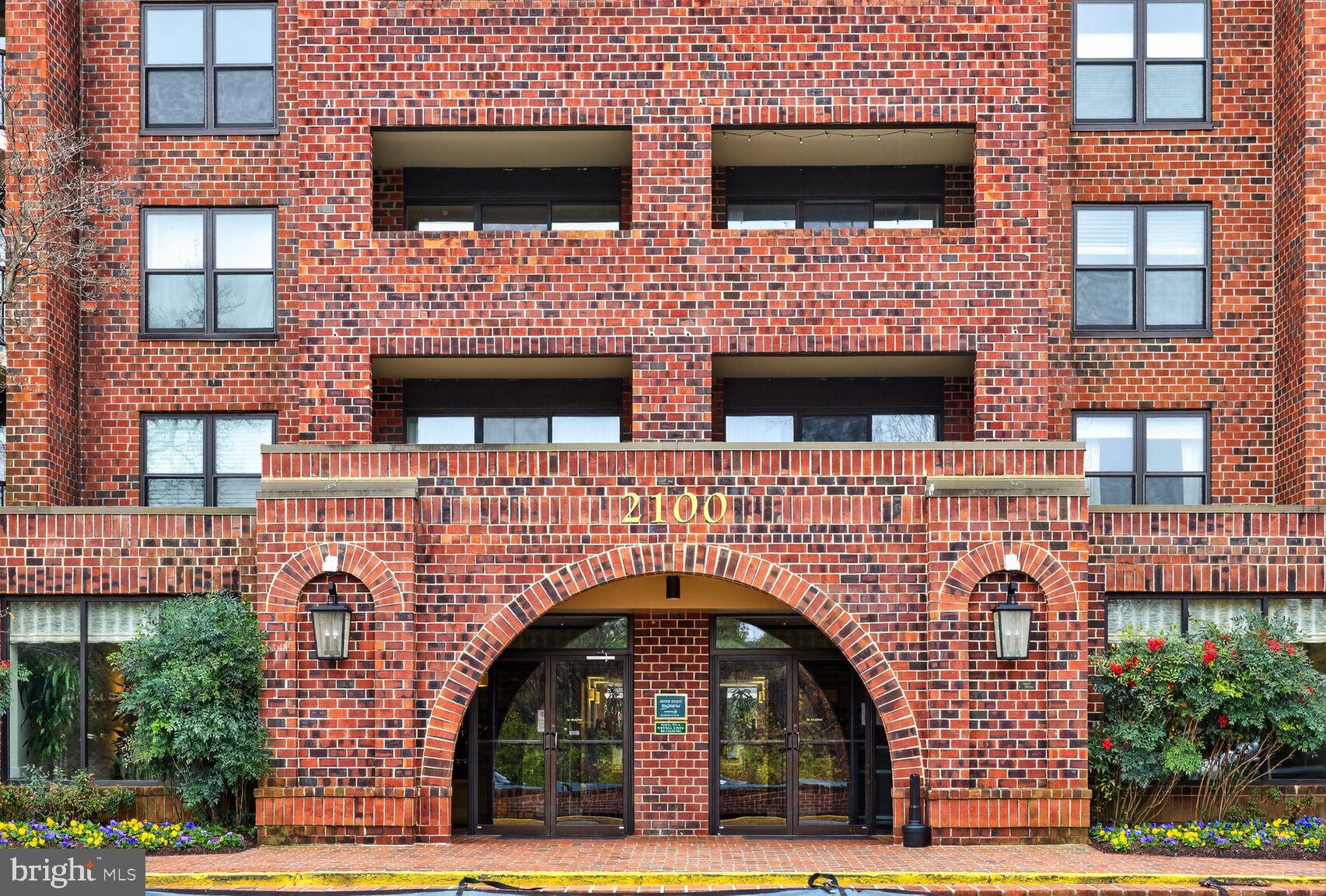 2100 Langston Boulevard, Unit 339 Arlington, VA 22201 - Photo 14 of 21 a front view of a building with parking