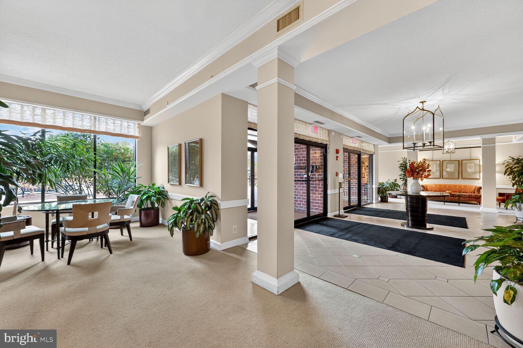 2100 Langston Boulevard, Unit 339 Arlington, VA 22201 - Photo 15 of 21 a lobby with furniture and a potted plant