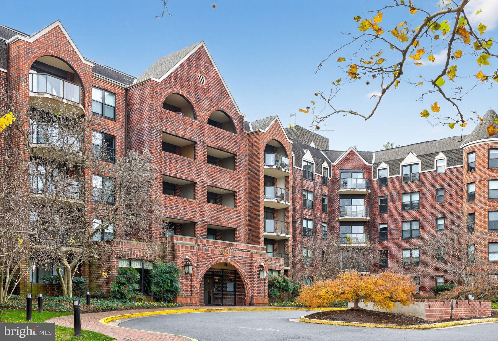 2100 Langston Boulevard, Unit 339 Arlington, VA 22201 - Photo 2 of 21 a front view of a building with lot of windows and fountain
