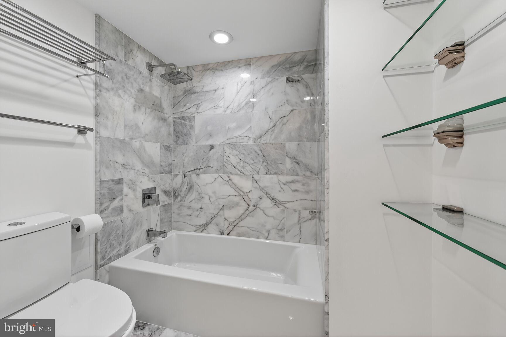 2100 Langston Boulevard, Unit 339 Arlington, VA 22201 - Photo 6 of 21 a bathroom with a toilet and a bathtub