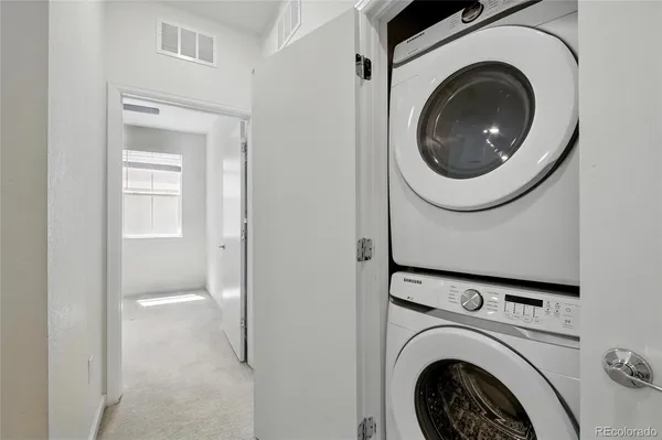 a close view of a utility room with dryer and washer