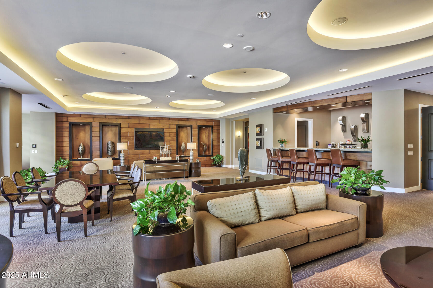 2211 East Camelback Road, Unit 506 Phoenix, AZ 85016 - Photo 6 of 10 a living room with furniture and a potted plant