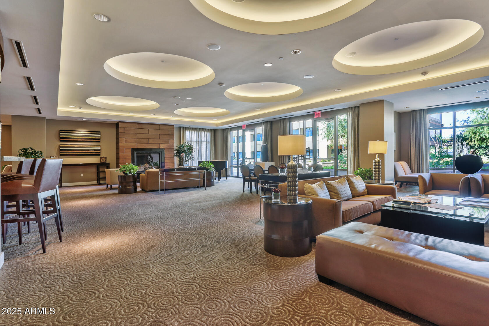 2211 East Camelback Road, Unit 506 Phoenix, AZ 85016 - Photo 8 of 10 a living room with furniture and a large window