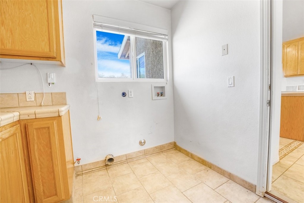 11221 Omelveny Road Oak Hills, CA 92344 - Photo 17 of 40 Laundry Room