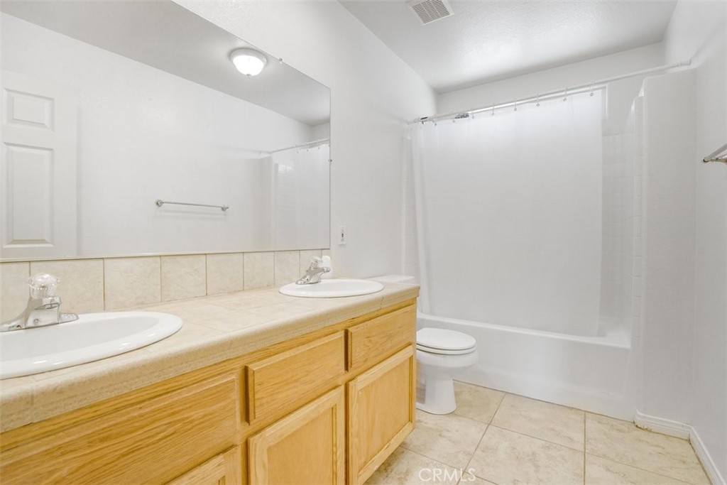 11221 Omelveny Road Oak Hills, CA 92344 - Photo 24 of 40 Bathroom Hallway