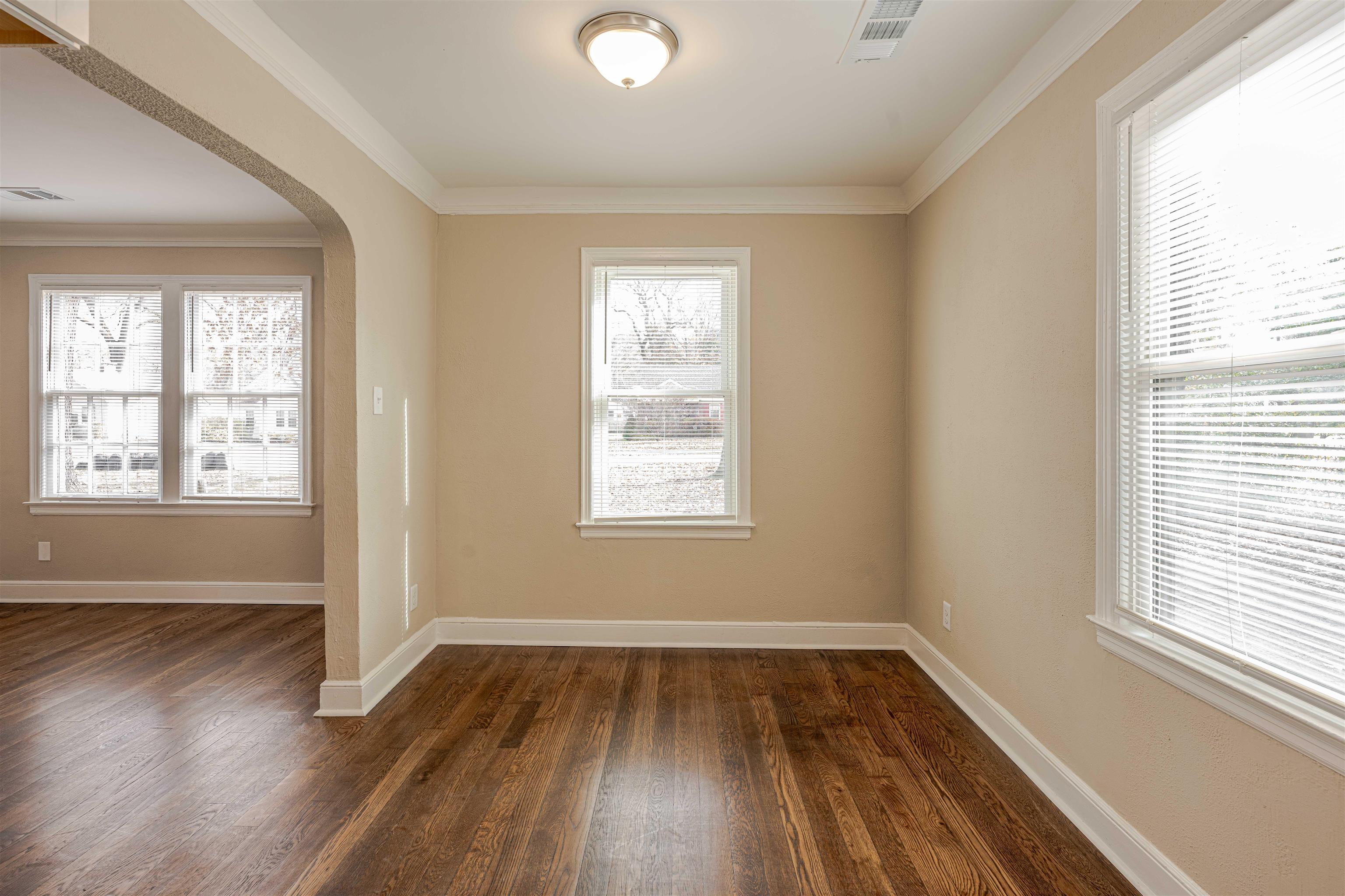 721 South Graham Street Memphis, TN 38111 - Photo 12 of 28 a view of an empty room with wooden floor and a window