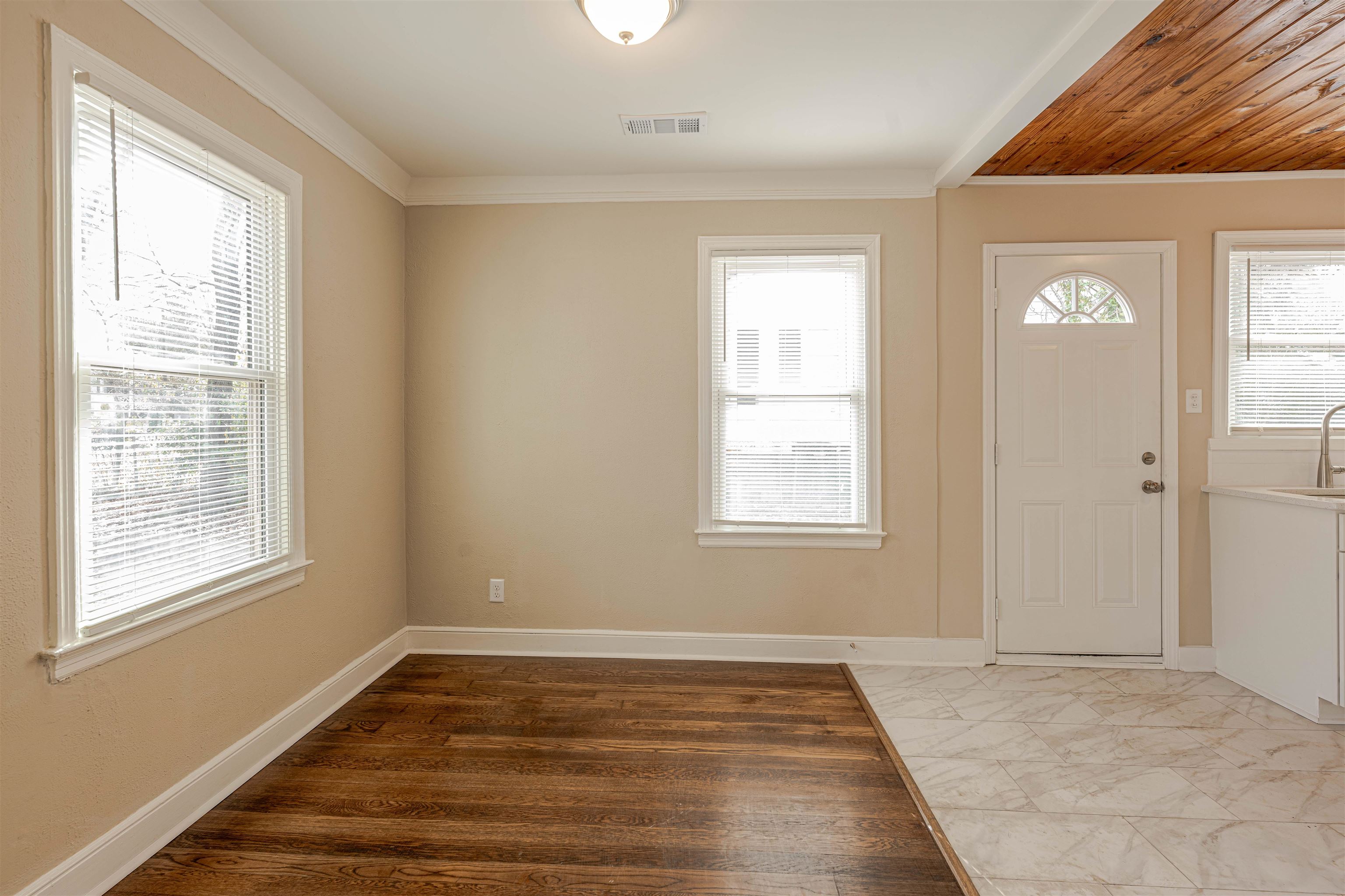 721 South Graham Street Memphis, TN 38111 - Photo 13 of 28 a view of an empty room with wooden floor and a window