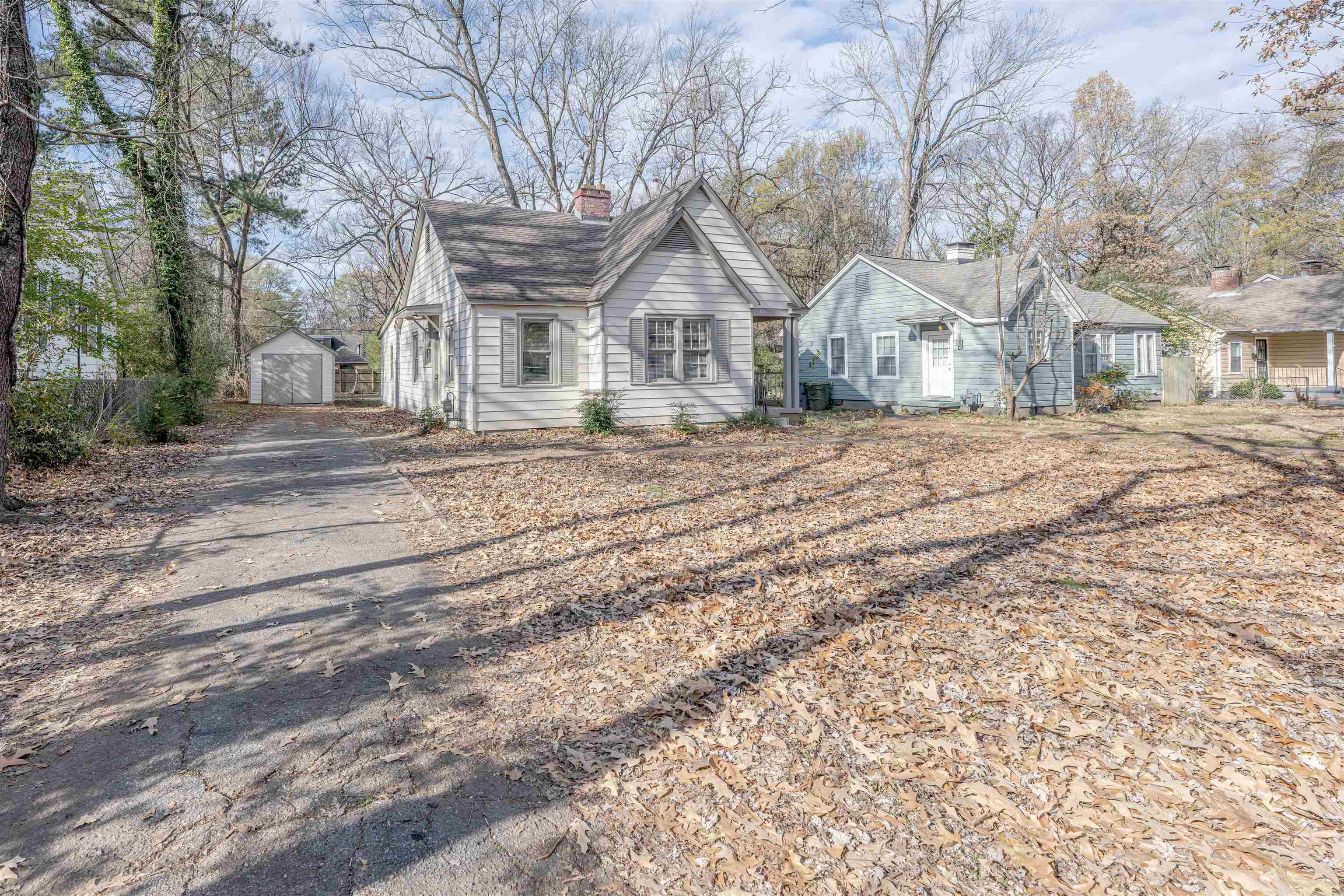 721 South Graham Street Memphis, TN 38111 - Photo 22 of 28 a view of a house with a yard covered in the forest