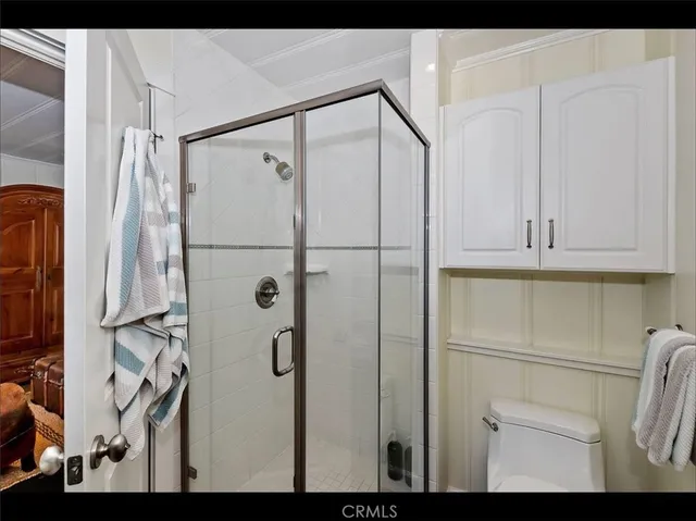 a bathroom with a shower and a sink