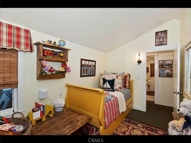 a bedroom with furniture and a bed