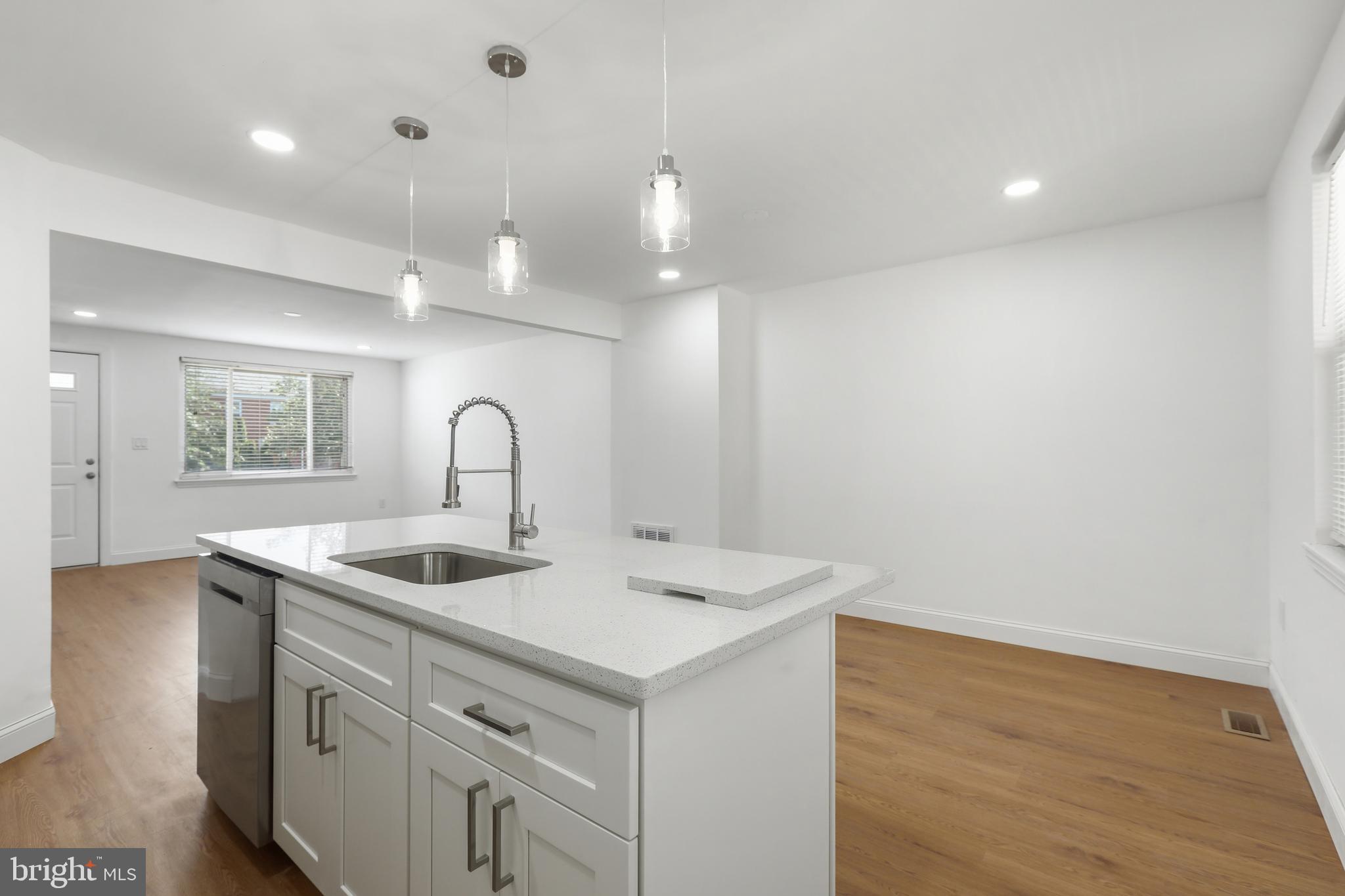 1714 Pin Oak Road Parkville, MD 21234 - Photo 16 of 41 Island with sink, dishwasher & pendant lights