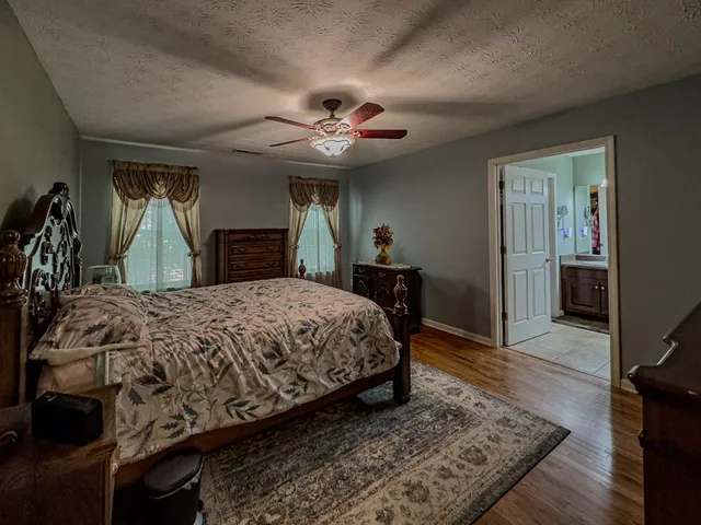 a bathroom with a bathtub and toilet